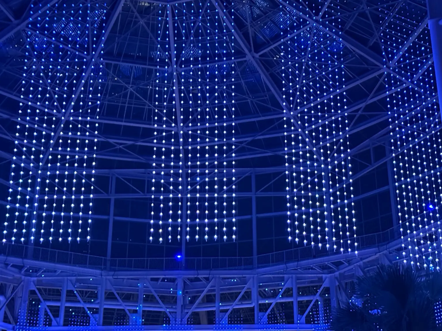 Blue LED curtain lights installed in a large indoor holiday lighting display