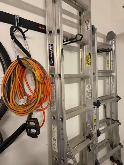 Philip Meyer's professional high-access equipment including Louisville and Little Giant style multi-position ladders